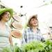 Green Things Farms co-owner Jill Lada and employee Sarah Alexander (left to right) sell merchandise during the Cobblestone Farm Farmers Market on Tuesday, May 21. Daniel Brenner I AnnArbor.com